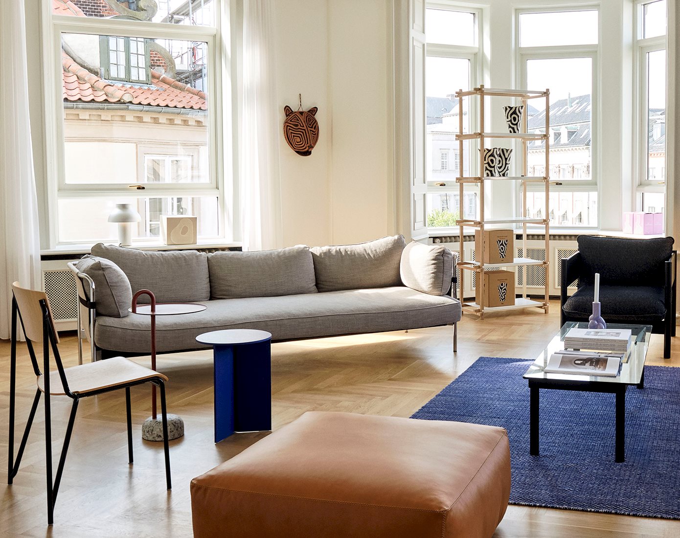 Inside HAY Rotterdam Store in the Netherlands with Can 3 Seater Sofa, Moiré Kelim Rug and Petit Standard Chair.